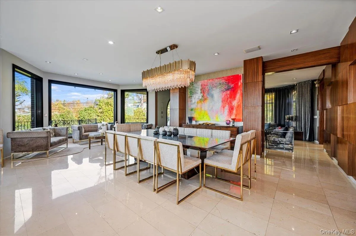 Dining space with recessed lighting and a chandelier Dining space with recessed lighting and a chandelier