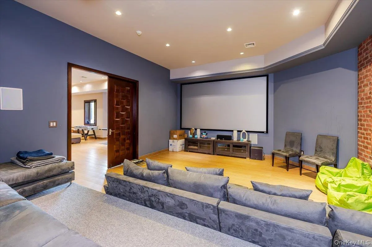 Home theater with recessed lighting and wood finished floors Home theater with recessed lighting and wood finished floors