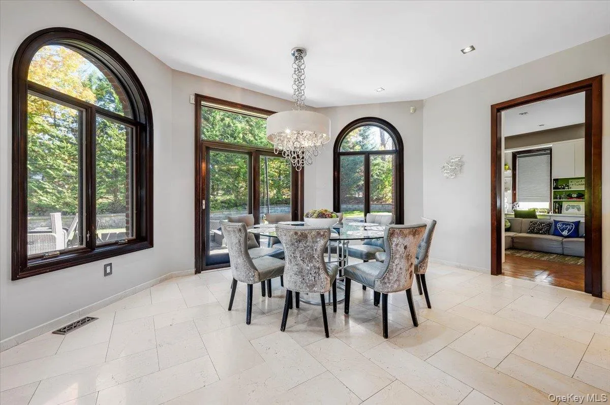 Dining room with baseboards and a chandelier Dining room with baseboards and a chandelier