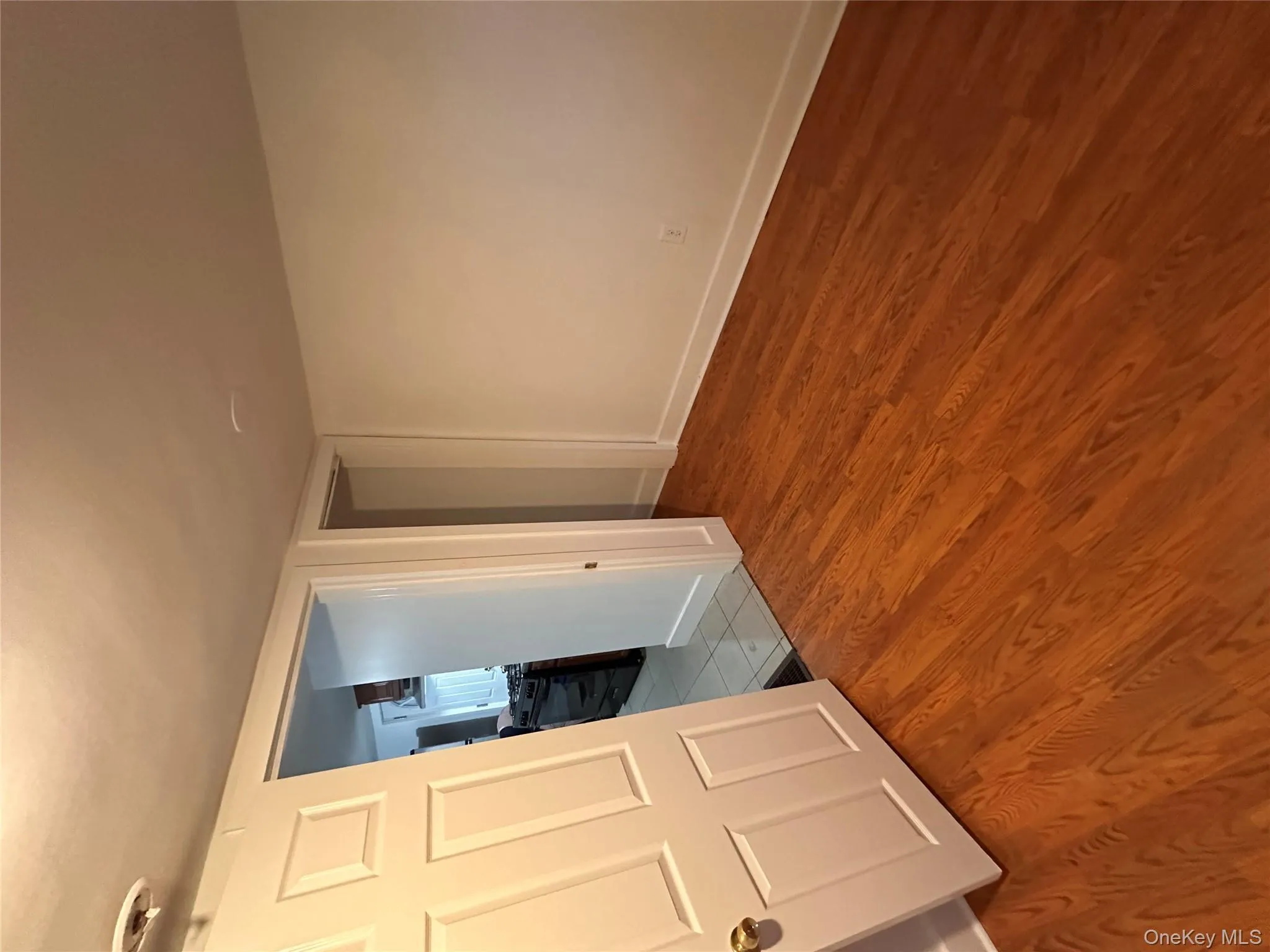 Empty room with wood finished floors and baseboards Empty room with wood finished floors and baseboards