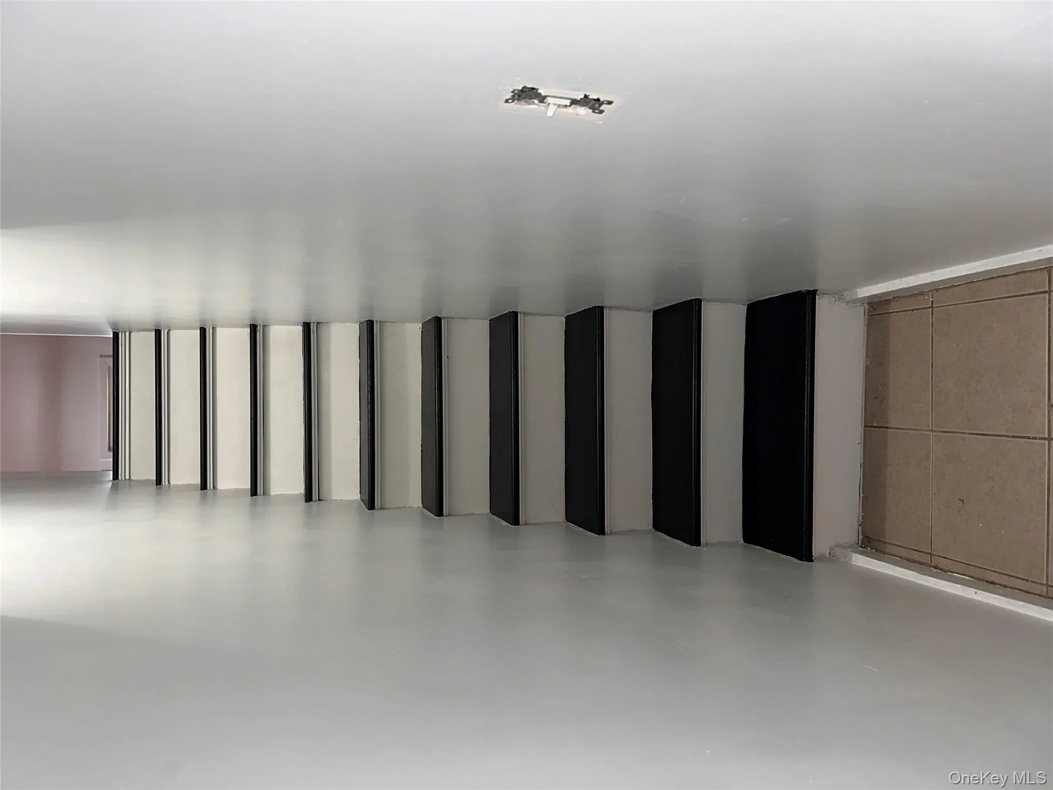 Stairs featuring tile patterned flooring and baseboards Stairs featuring tile patterned flooring and baseboards