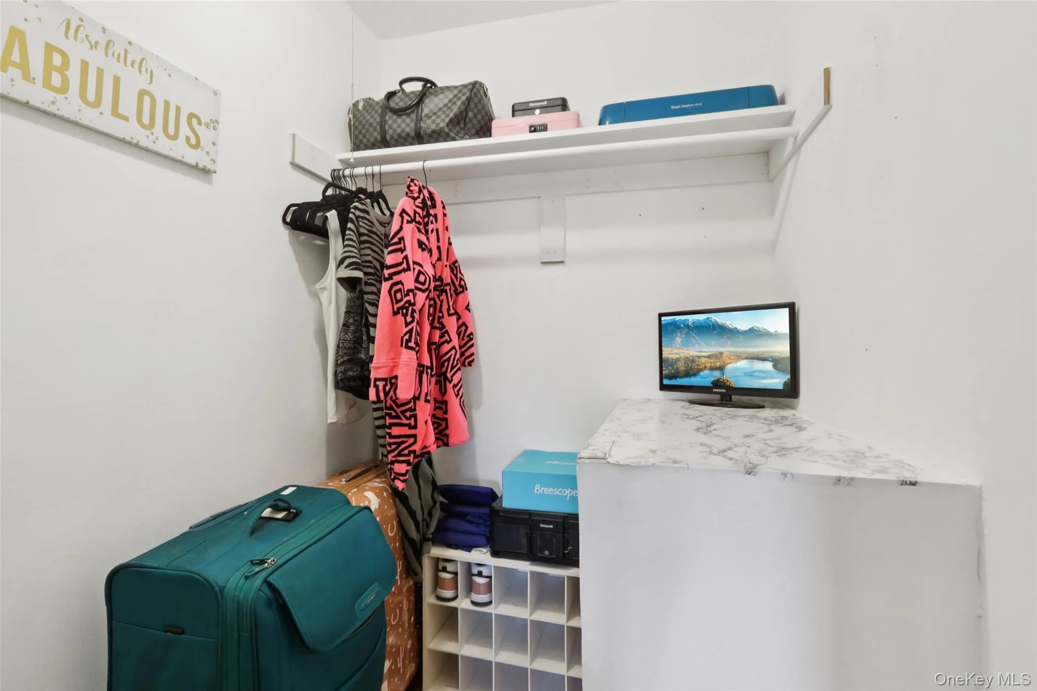Walk-in closet in primary bedroom with plenty of storage Walk-in closet in primary bedroom with plenty of storage