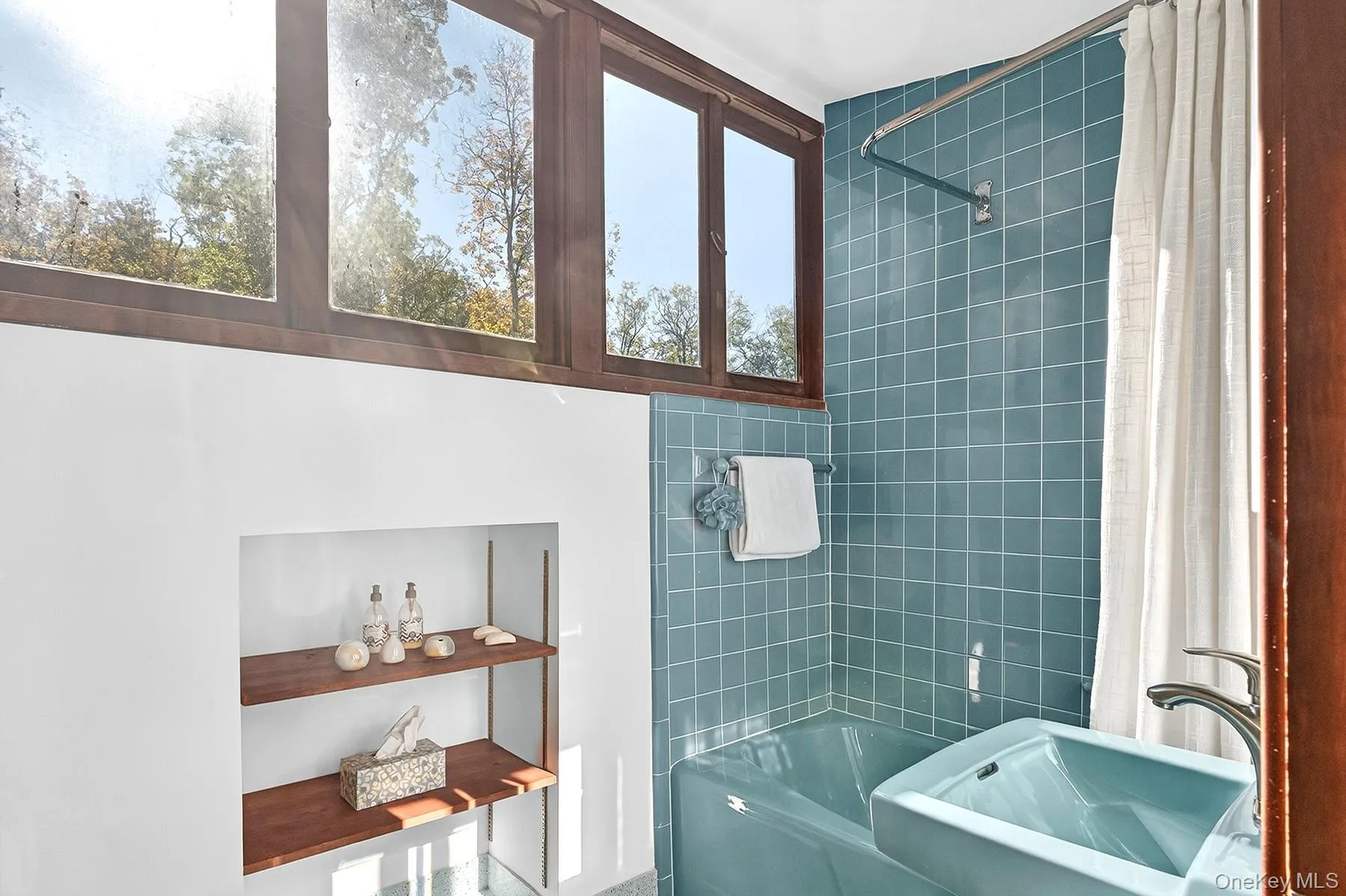 Bathroom with shower / bath combo and a sink Bathroom with shower / bath combo and a sink
