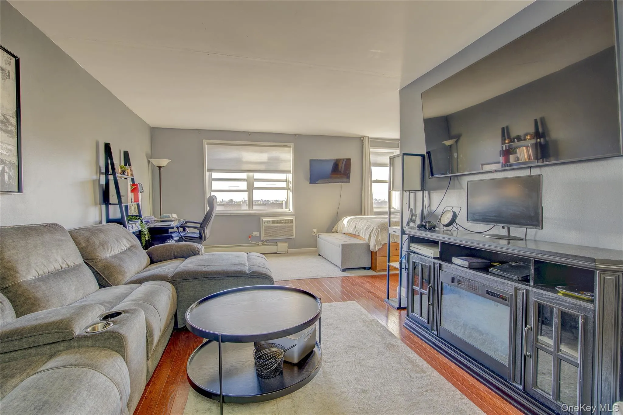 Living area featuring wood finished floors Living area featuring wood finished floors
