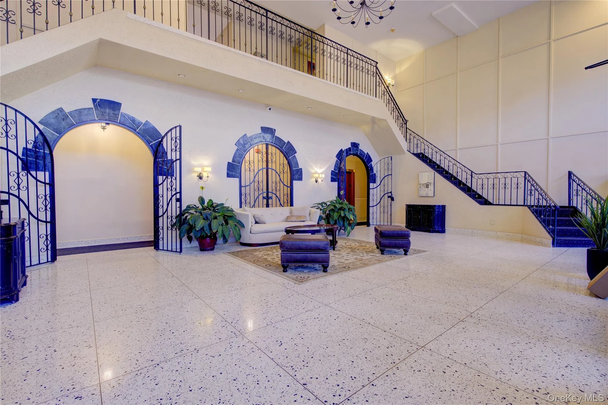 Common area with a towering ceiling and stairs Common area with a towering ceiling and stairs