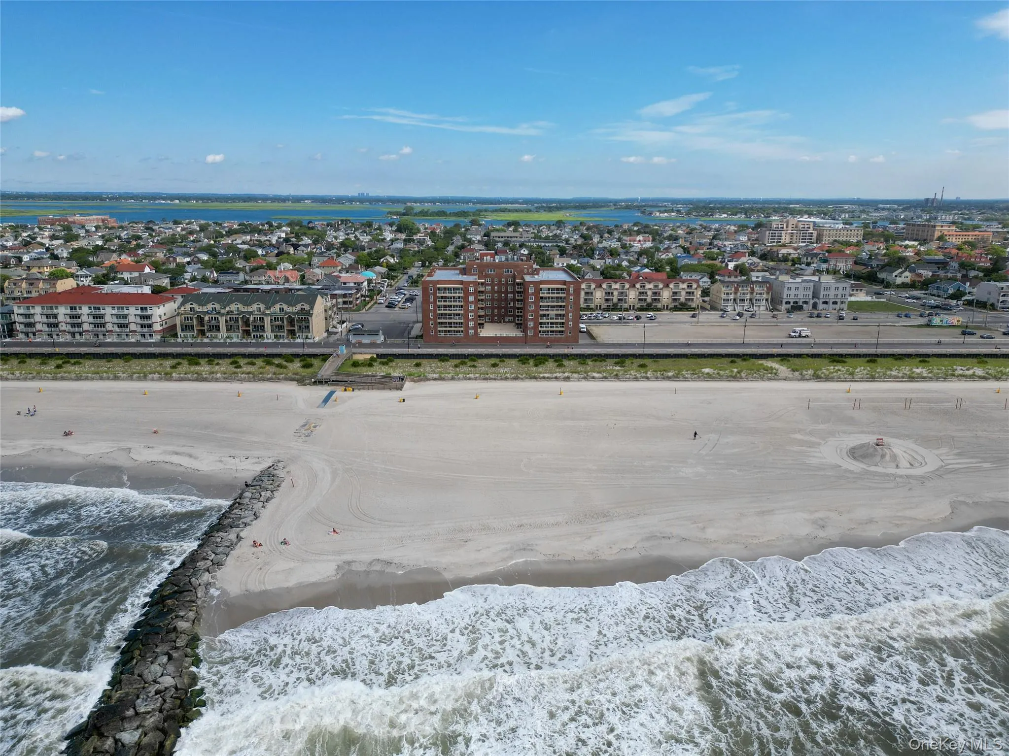 Drone / aerial view of waterfront with a beach Drone / aerial view of waterfront with a beach