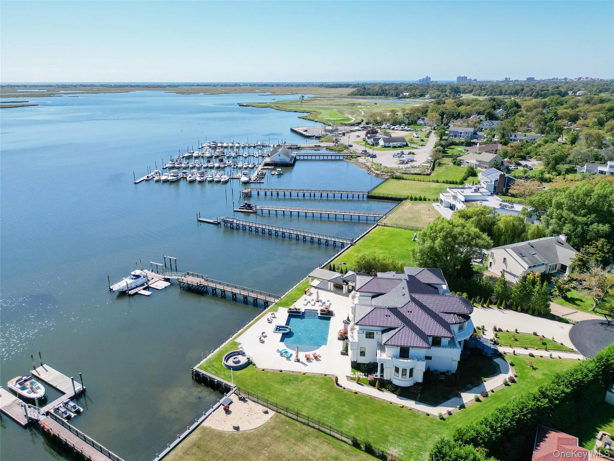 Aerial view of numerous boat docks and a large body of water Aerial view of numerous boat docks and a large body of water