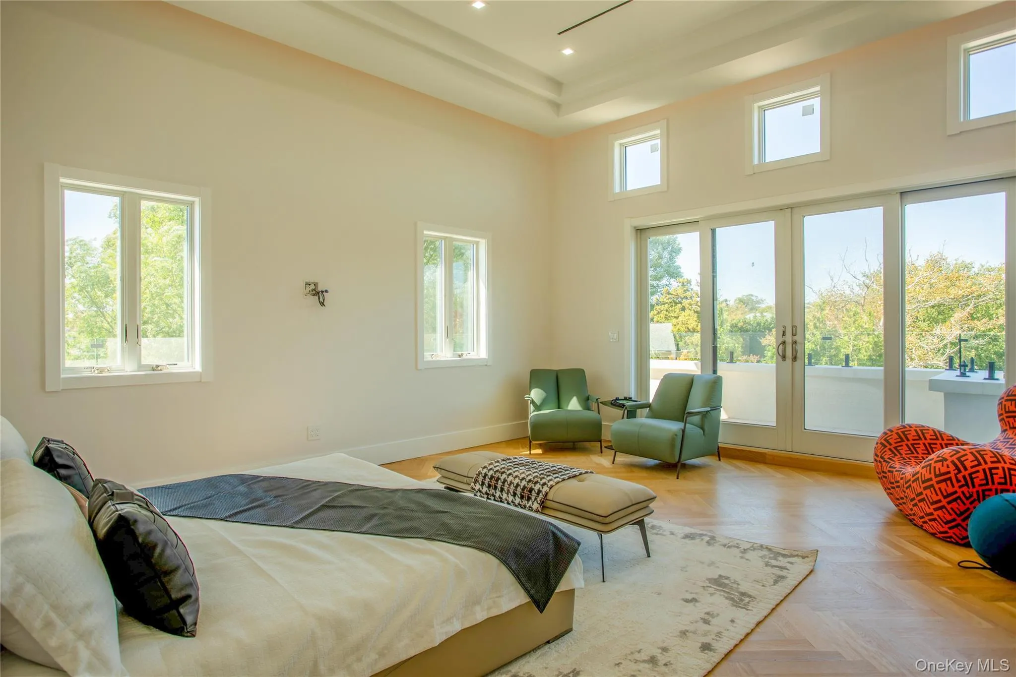 Bedroom with access to exterior, french doors, a towering ceiling, recessed lighting, and a tray ceiling Bedroom with access to exterior, french doors, a towering ceiling, recessed lighting, and a tray ceiling