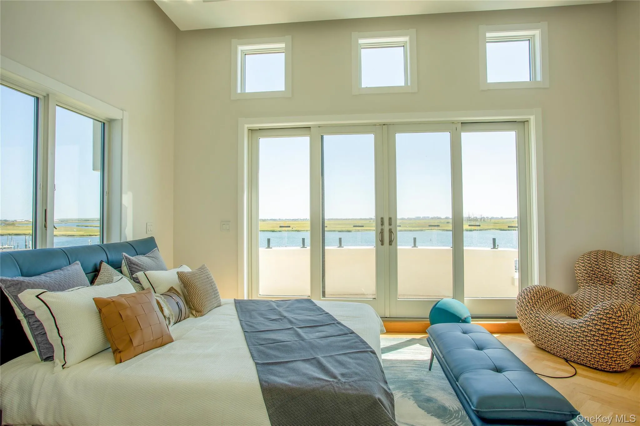Bedroom with access to outside and a water view Bedroom with access to outside and a water view
