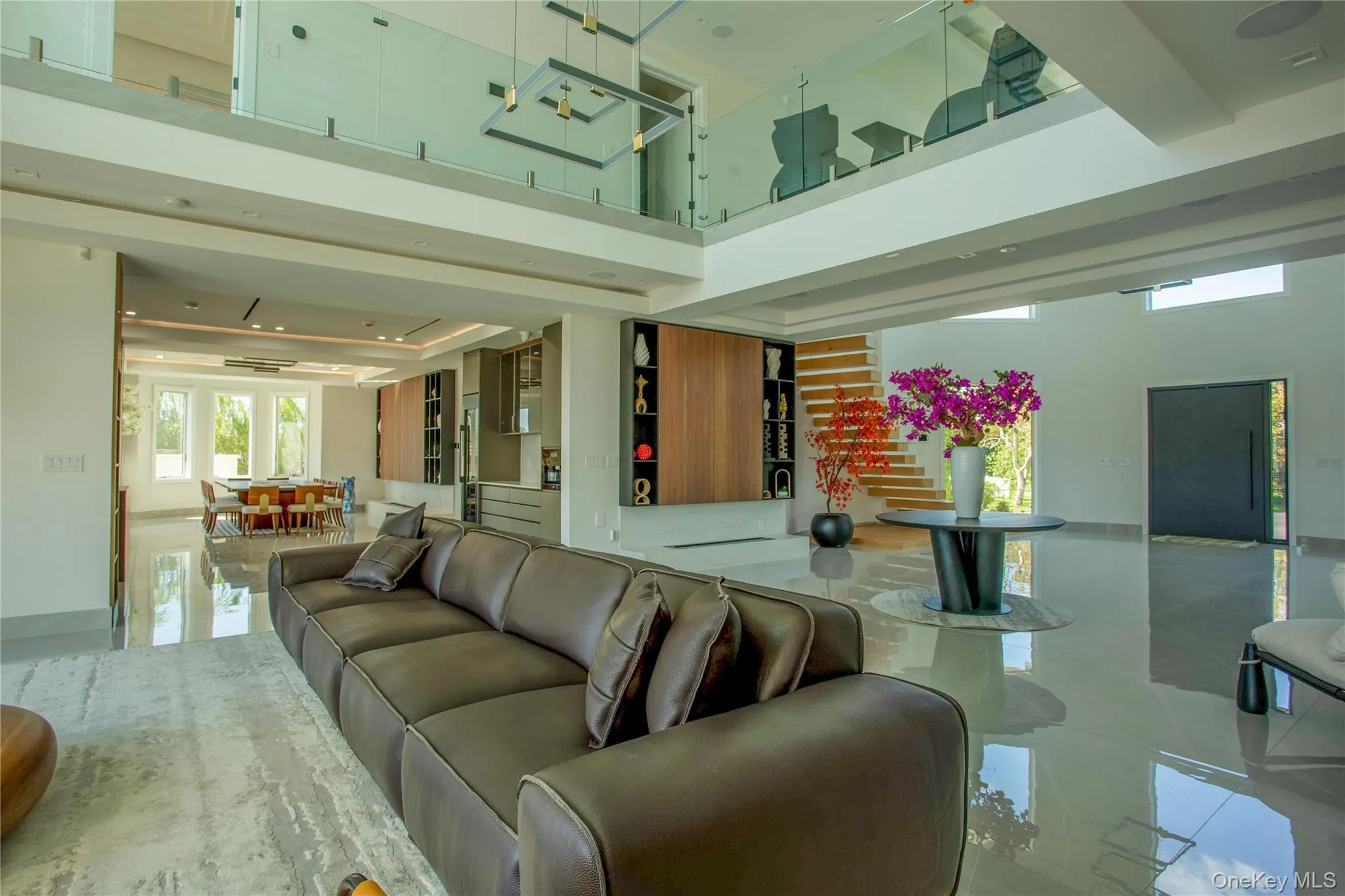 Building lobby featuring stairway and a high ceiling Building lobby featuring stairway and a high ceiling