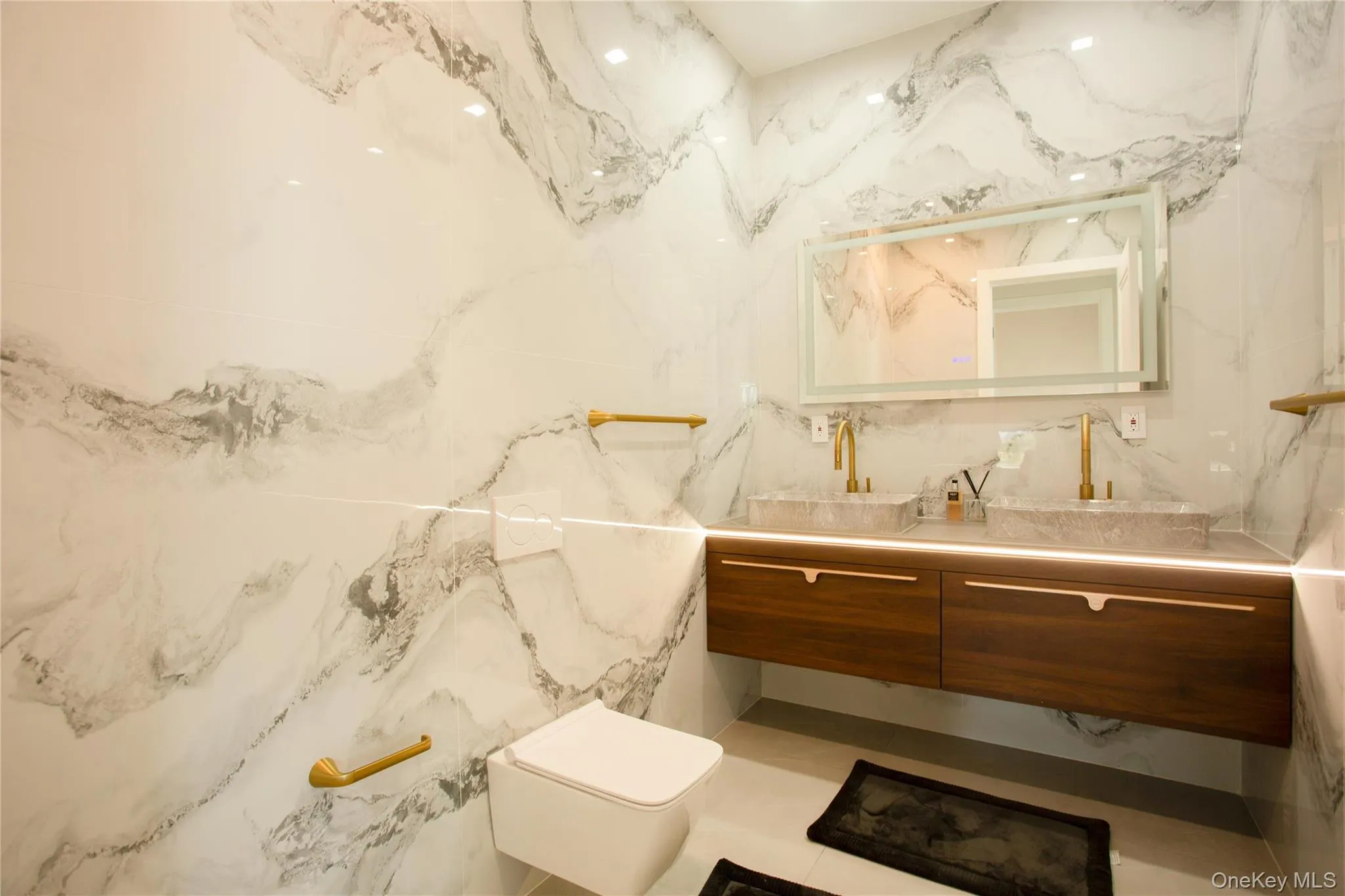 Bathroom featuring vanity and toilet Bathroom featuring vanity and toilet