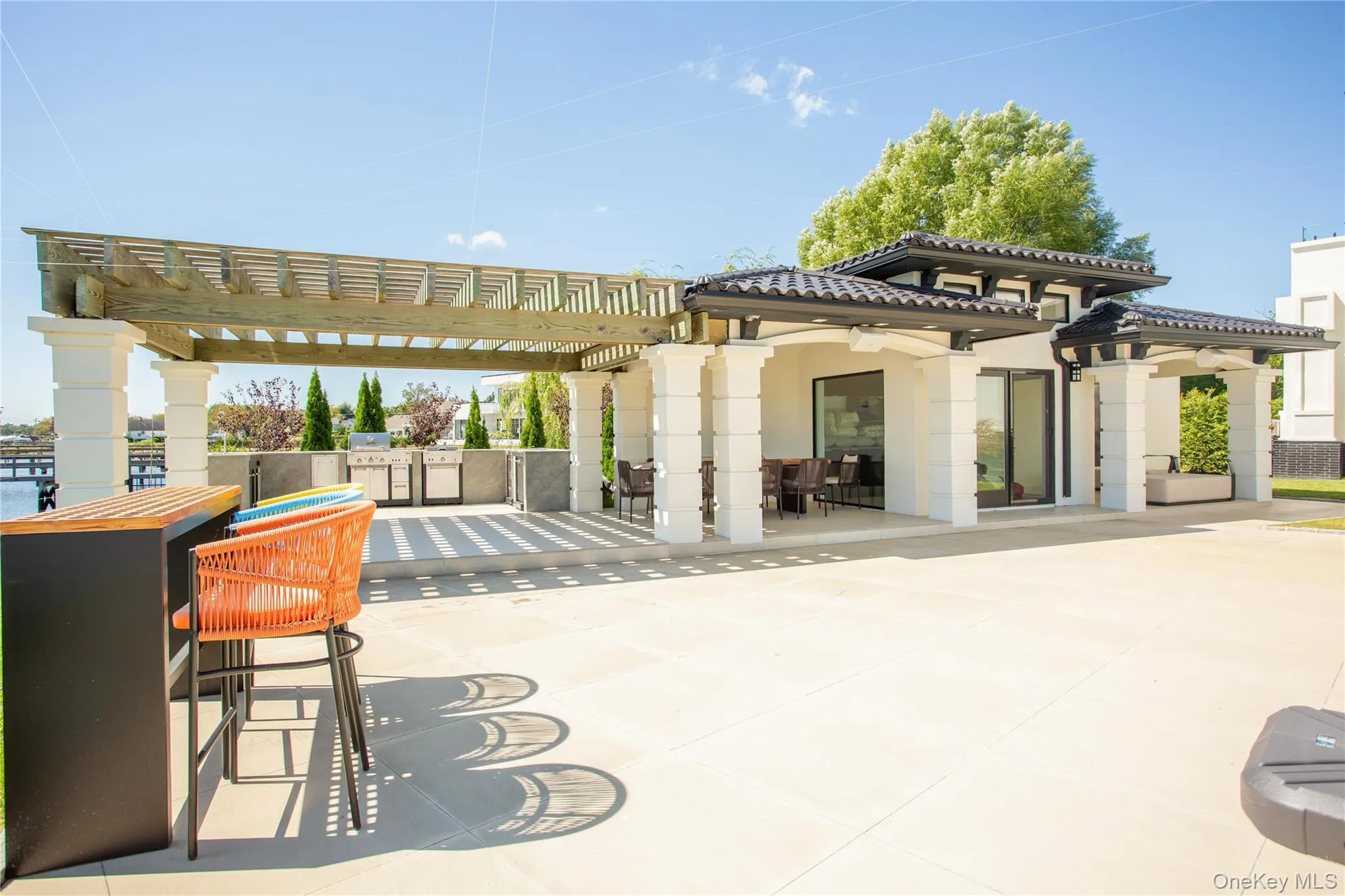 View of patio / terrace featuring a pergola and exterior kitchen View of patio / terrace featuring a pergola and exterior kitchen