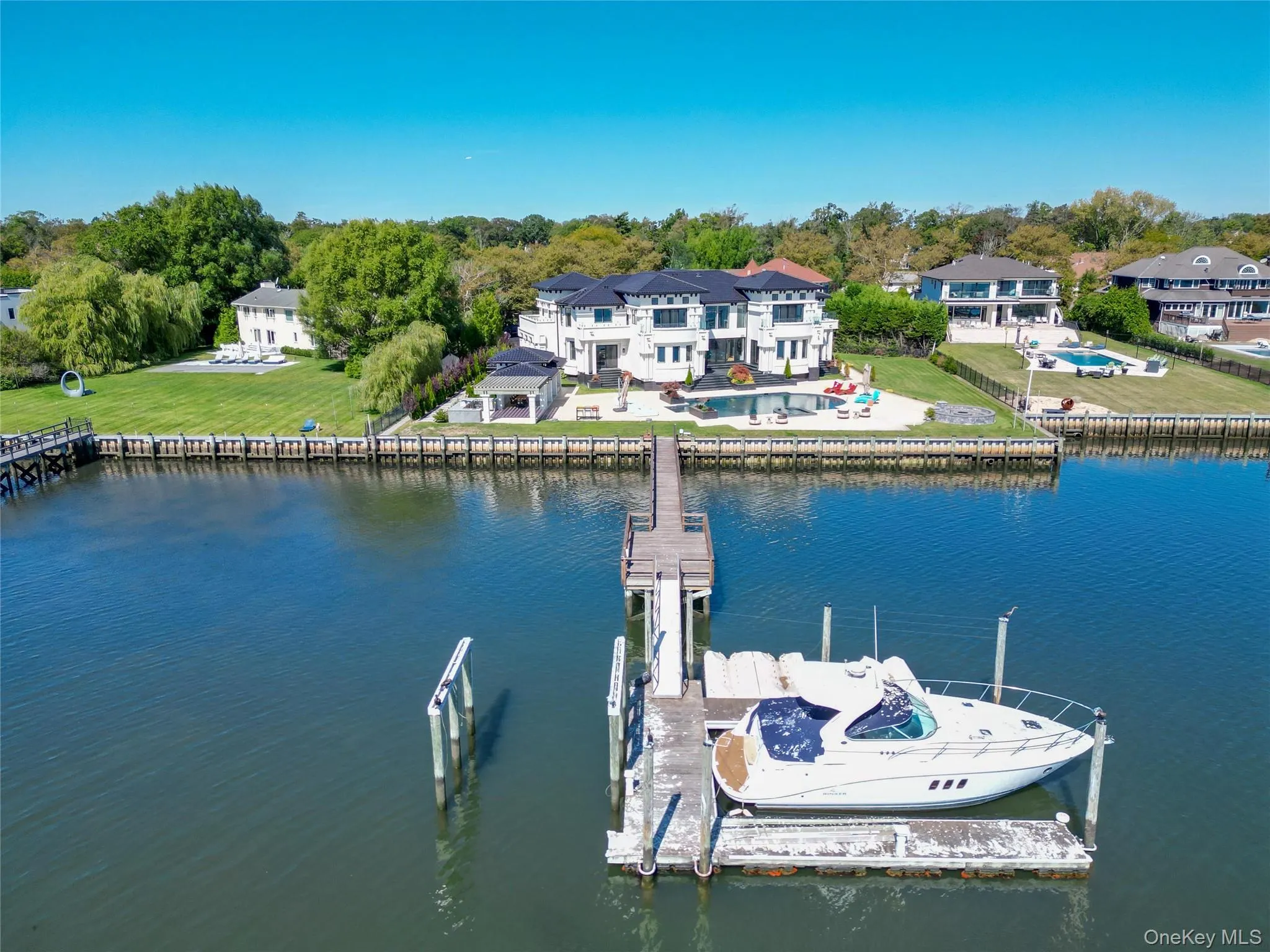 Dock with a water view and a lawn Dock with a water view and a lawn