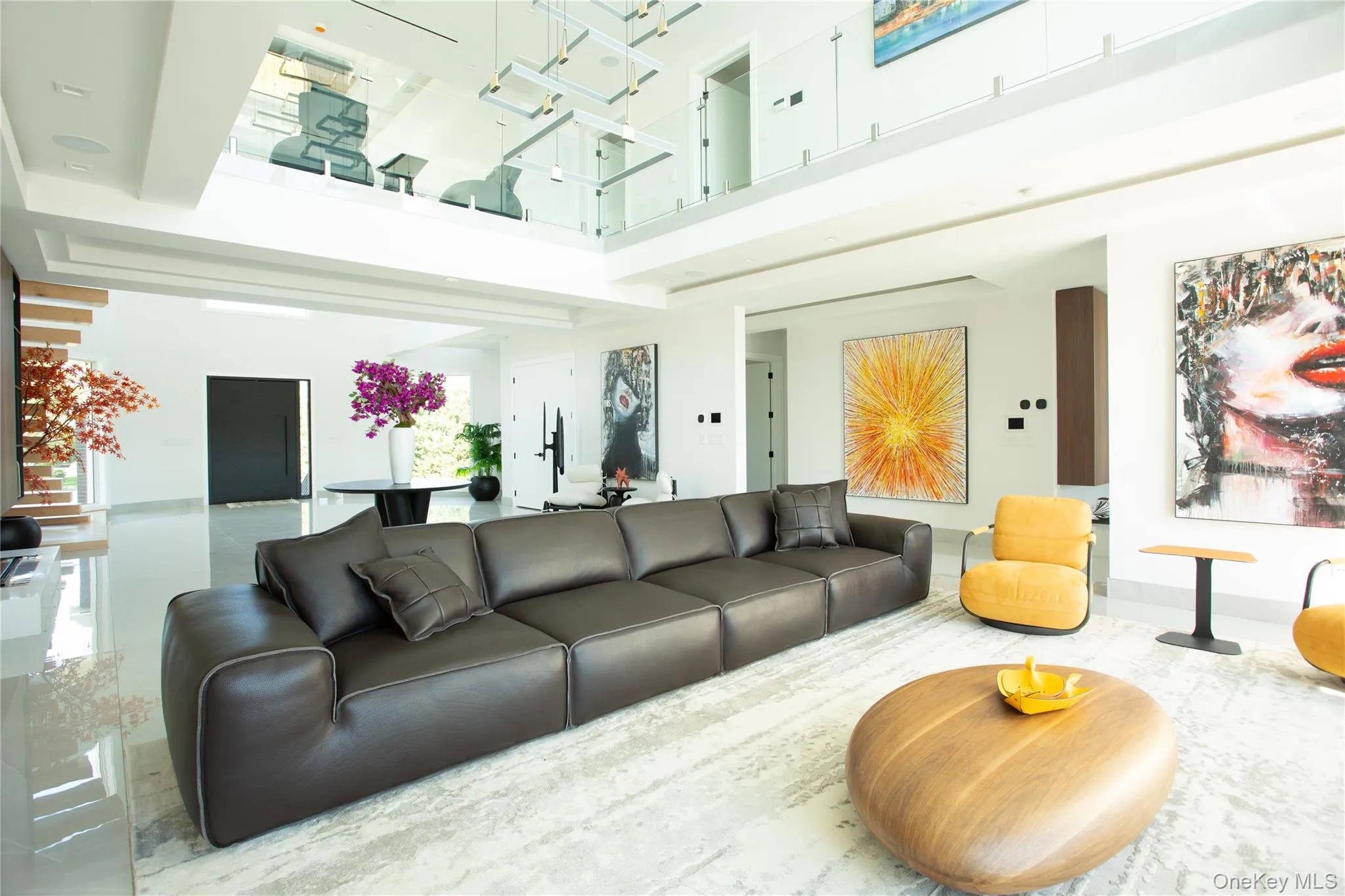 Living room featuring a high ceiling Living room featuring a high ceiling