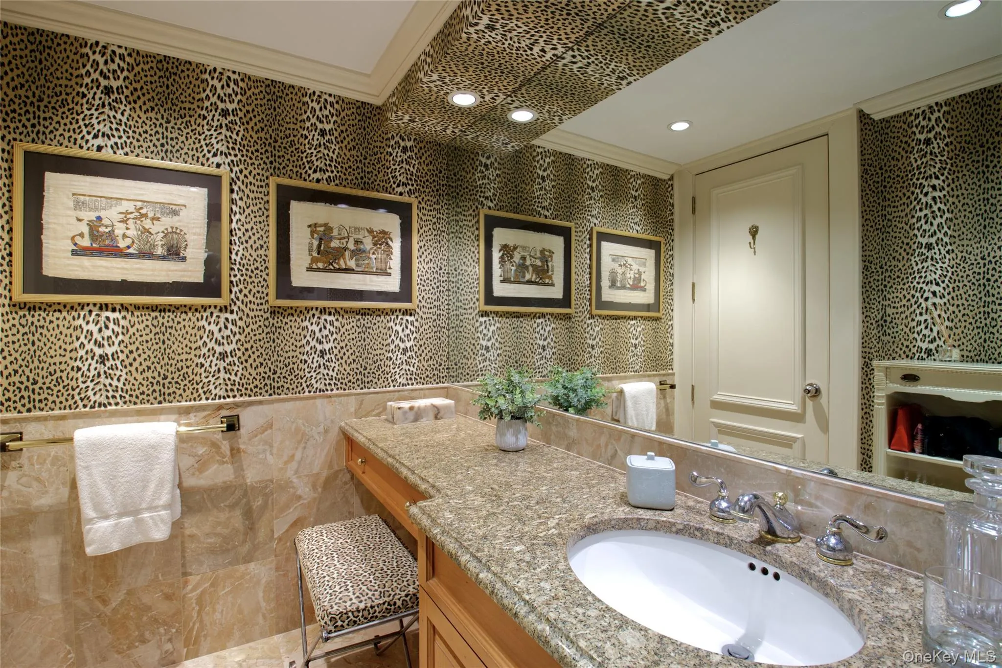 Half bath featuring crown molding, vanity, wallpapered walls, and recessed lighting Half bath featuring crown molding, vanity, wallpapered walls, and recessed lighting