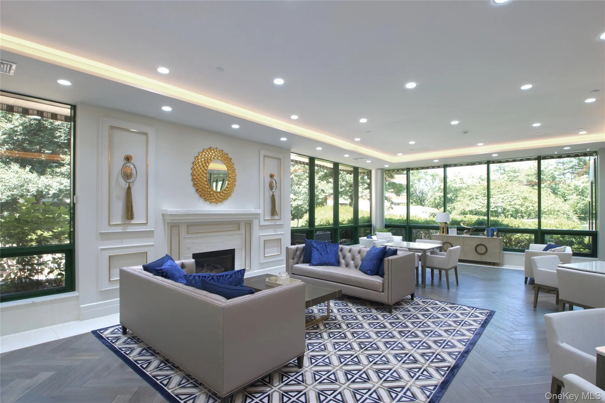 Building lobby featuring recessed lighting and a wall of windows Building lobby featuring recessed lighting and a wall of windows