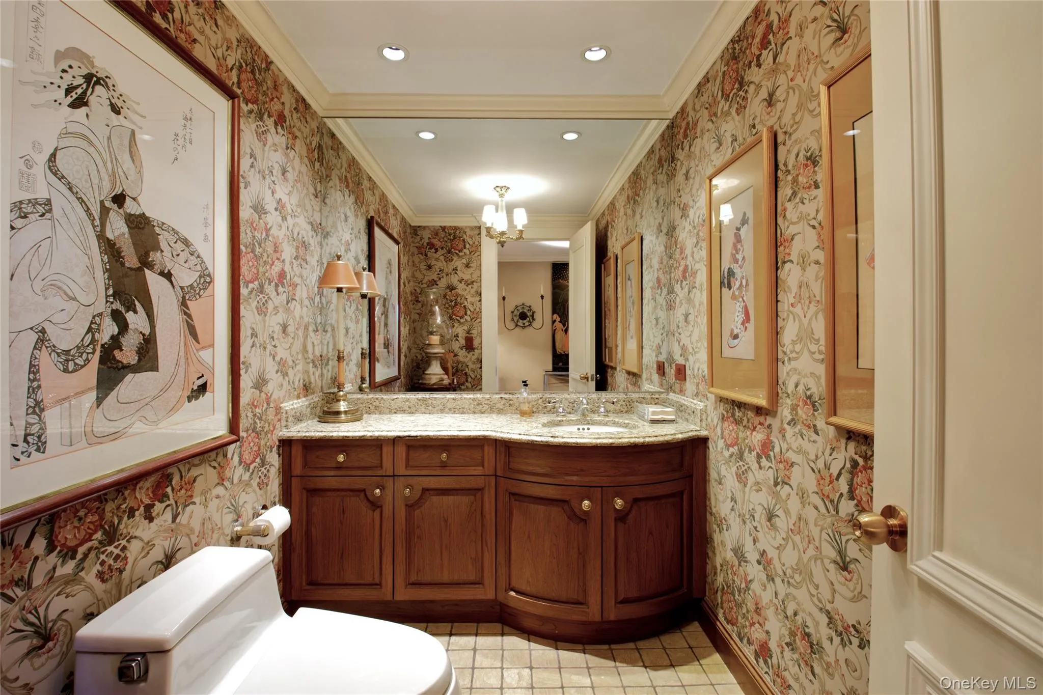 Half bathroom featuring wallpapered walls, a chandelier, vanity, ornamental molding, and recessed lighting Half bathroom featuring wallpapered walls, a chandelier, vanity, ornamental molding, and recessed lighting