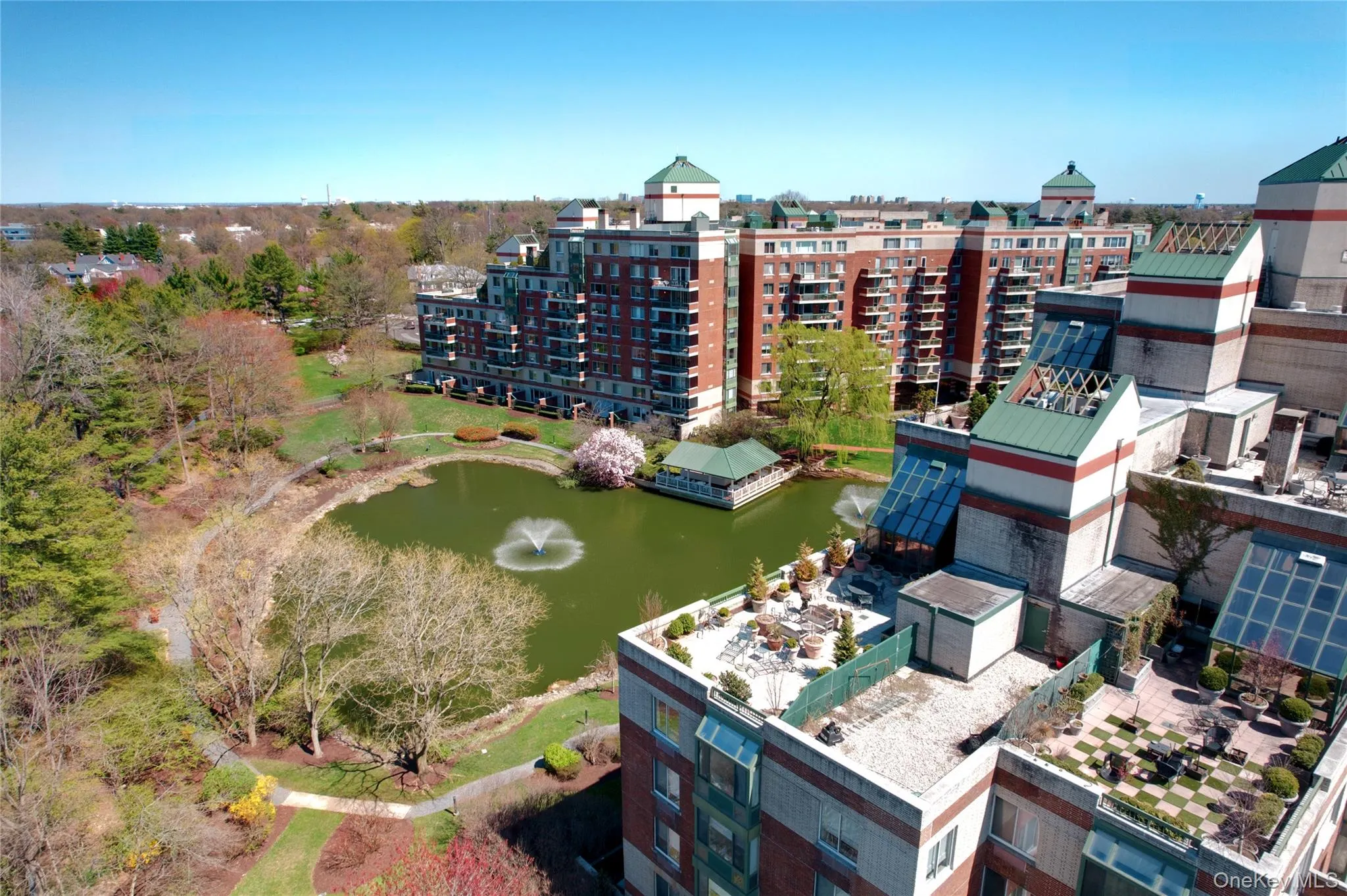 Bird's eye view of apartment complex / building and a large body of water Bird's eye view of apartment complex / building and a large body of water