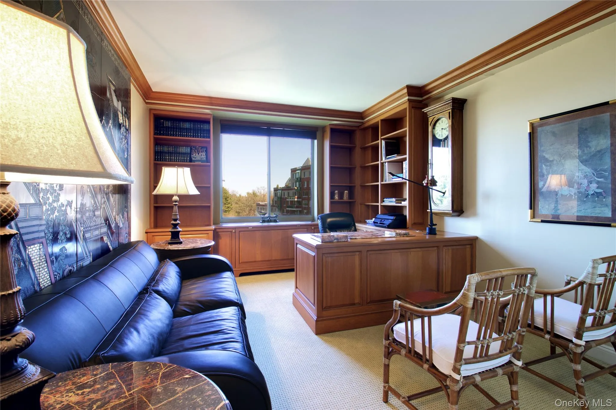 Office space featuring ornamental molding and light colored carpet Office space featuring ornamental molding and light colored carpet