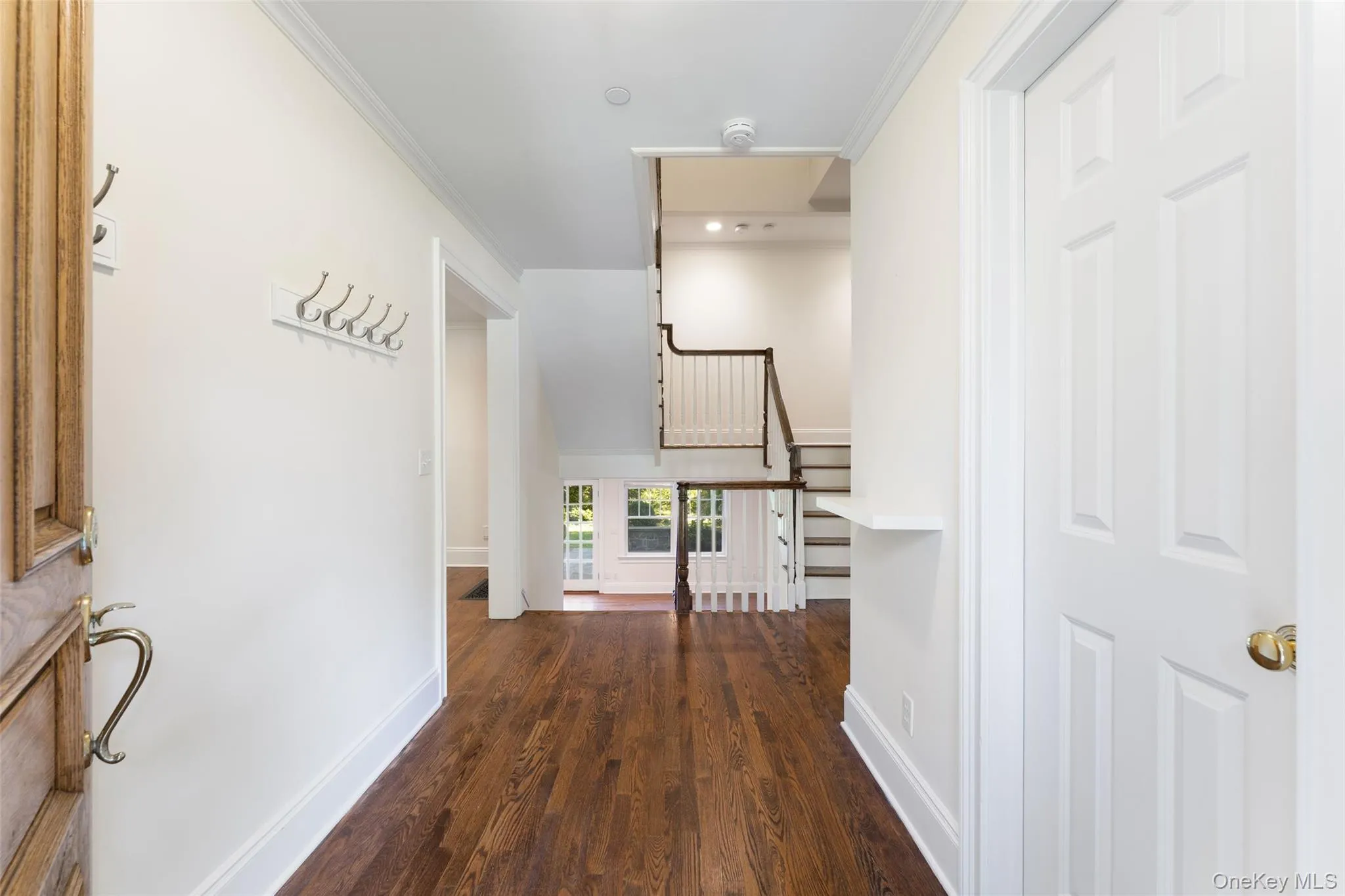 Entry with powder room to right Entry with powder room to right