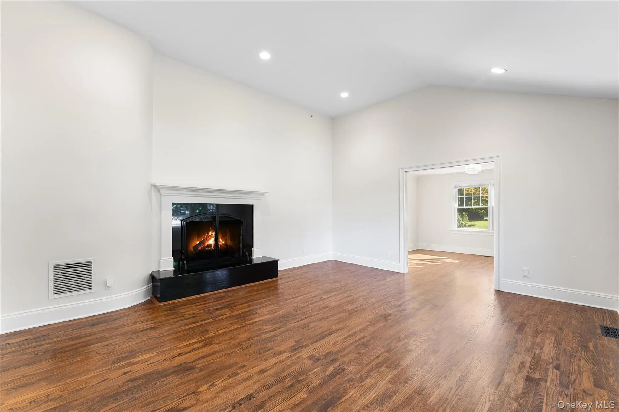 Living room with cathedral ceilings and wood burning fire place Living room with cathedral ceilings and wood burning fire place