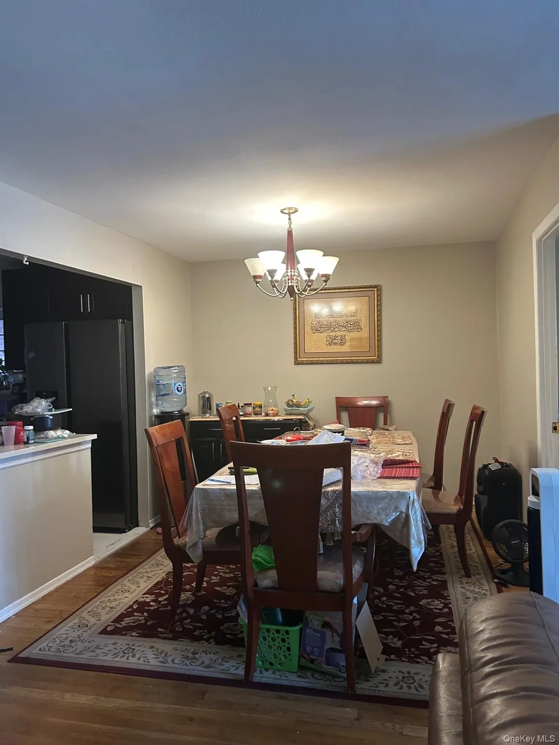 Dining room featuring a chandelier and wood finished floors Dining room featuring a chandelier and wood finished floors