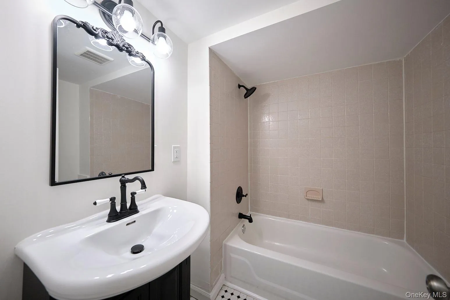 Full bath featuring shower / bath combination and vanity Full bath featuring shower / bath combination and vanity