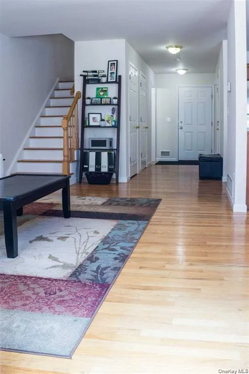 Foyer with stairway and light wood-style floors Foyer with stairway and light wood-style floors