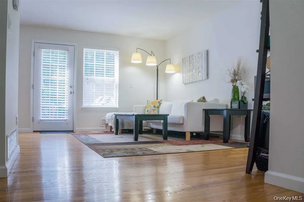 Dining space featuring light wood-style floors and baseboards Dining space featuring light wood-style floors and baseboards