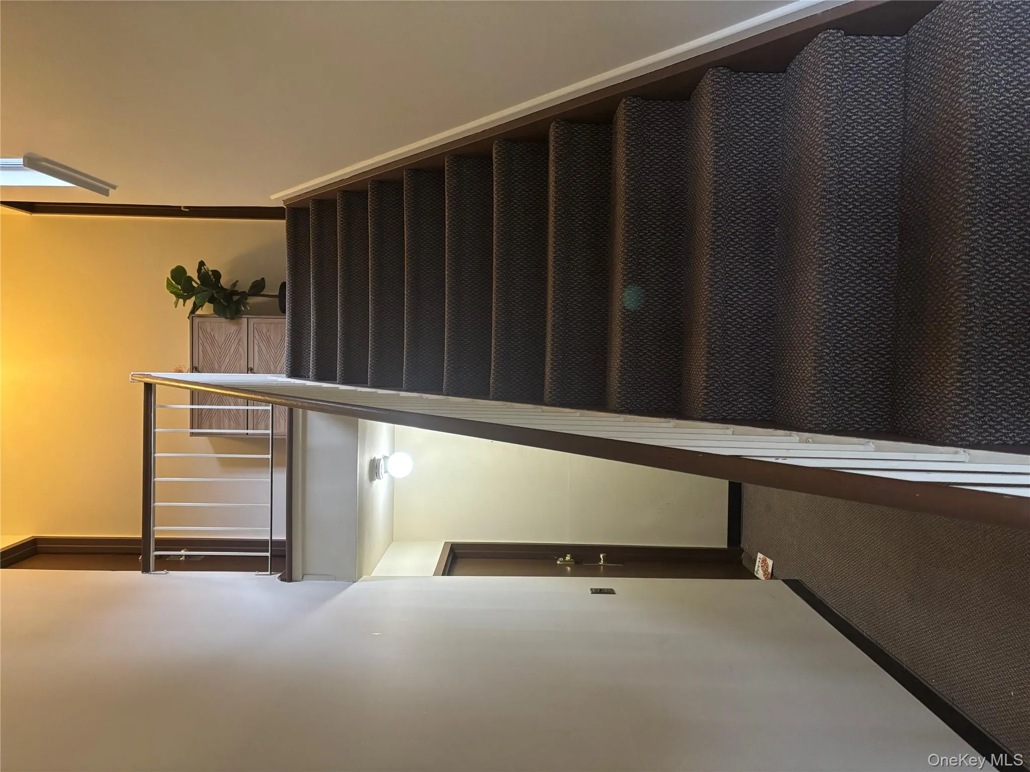 Stairway with baseboards and carpet flooring Stairway with baseboards and carpet flooring