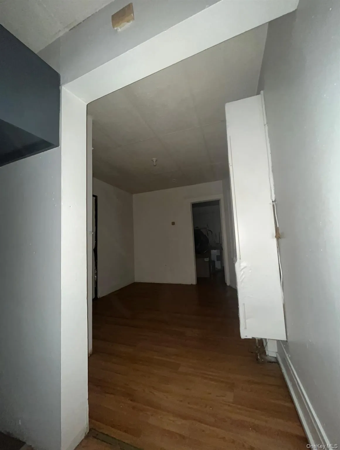 Hallway with dark wood finished floors Hallway with dark wood finished floors