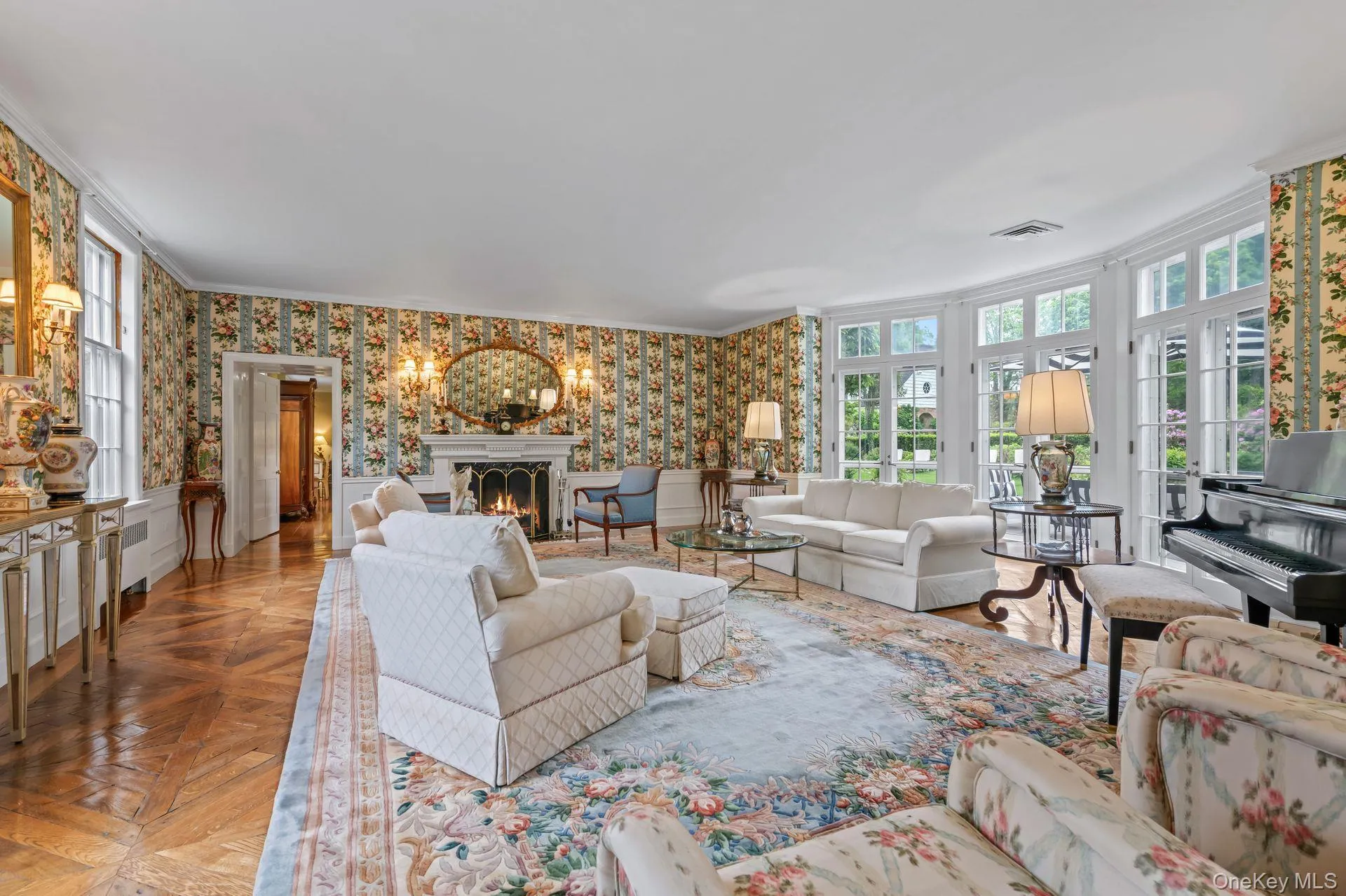 Grand Living room with wood burning fireplace and great natural light Grand Living room with wood burning fireplace and great natural light