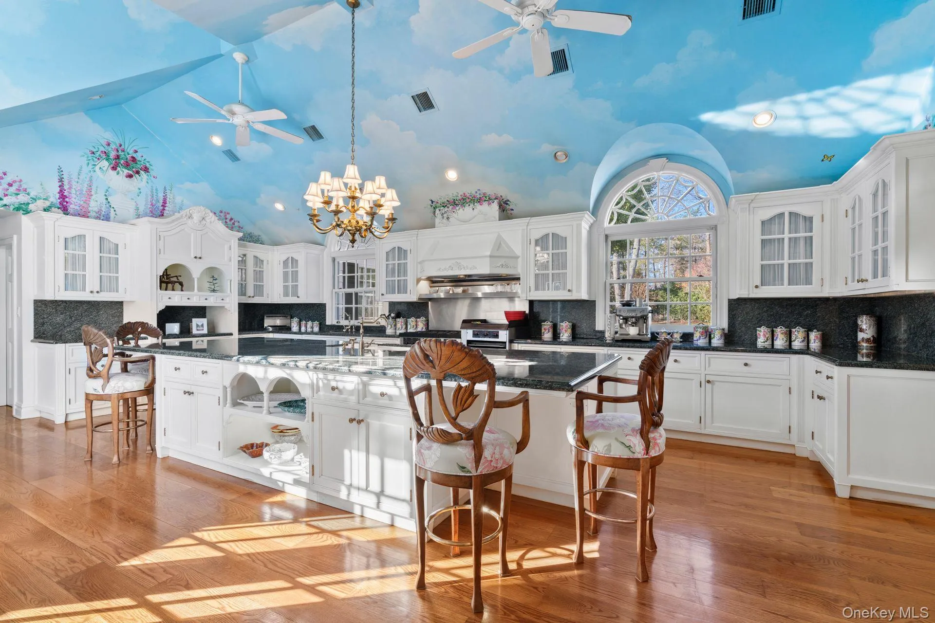 Large, sprawling kitchen with multiple seating areas Large, sprawling kitchen with multiple seating areas