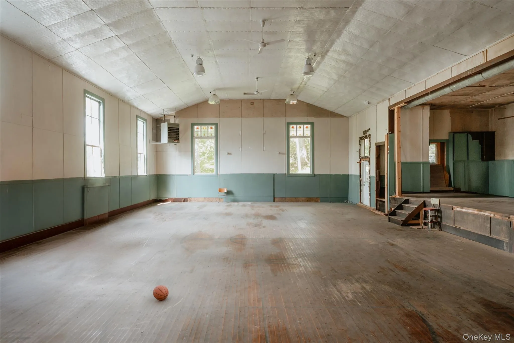 gym with vaulted ceiling, propane heater, stage gym with vaulted ceiling, propane heater, stage