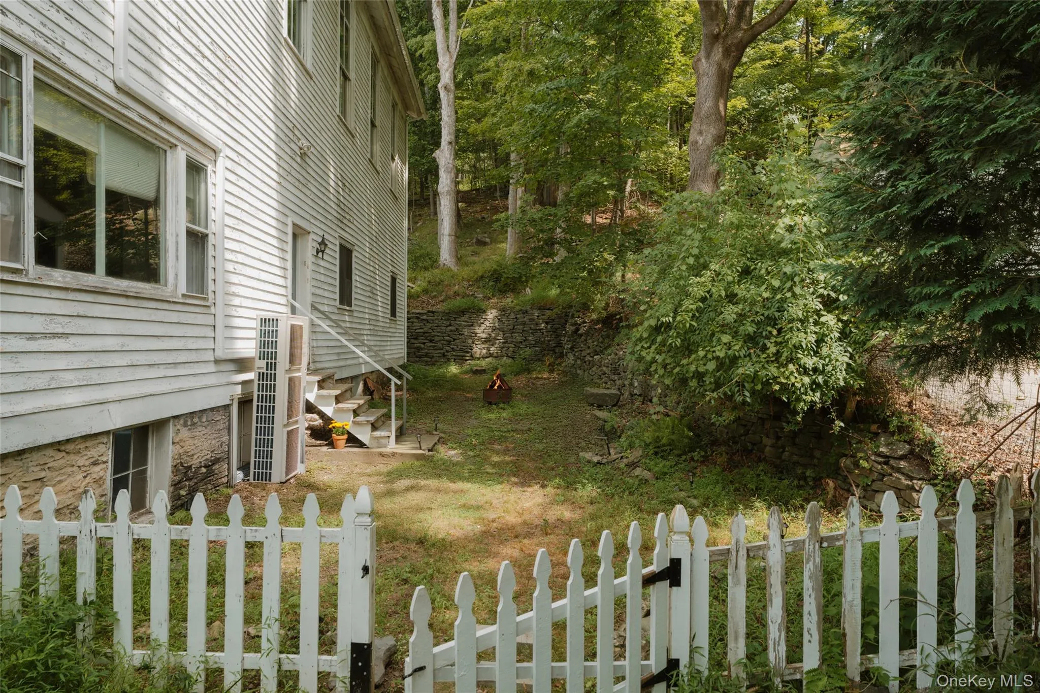 View of yard with entry steps View of yard with entry steps