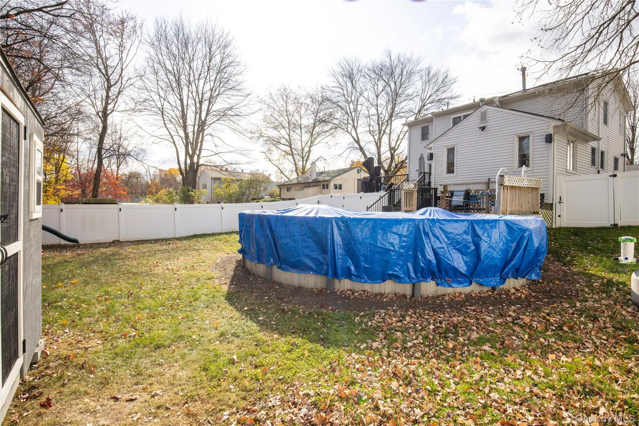 Fenced backyard featuring a gate Fenced backyard featuring a gate