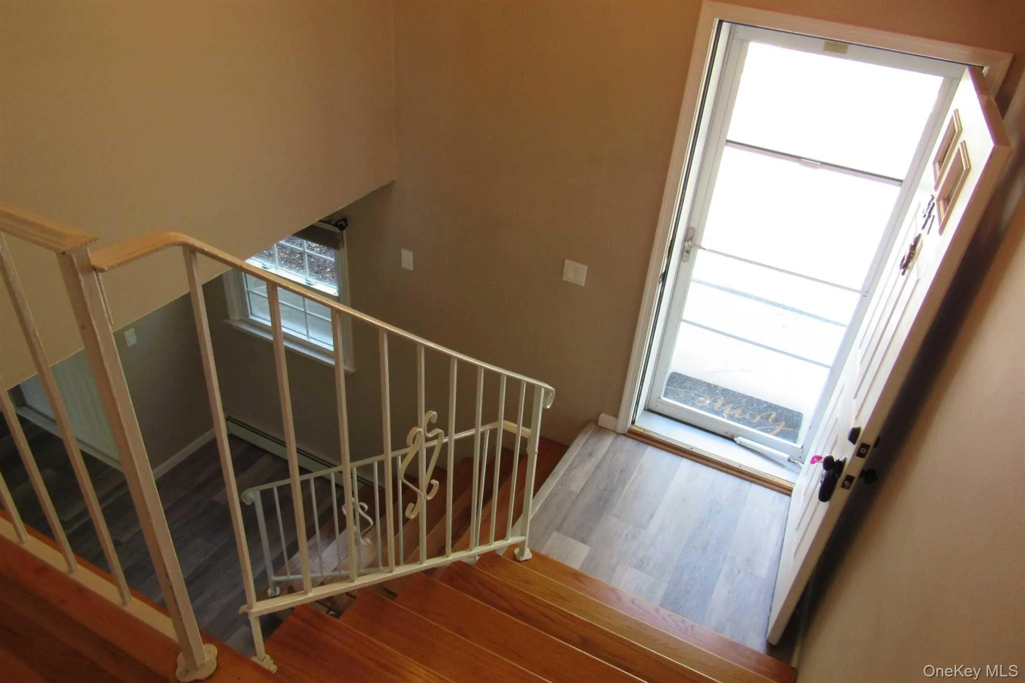 Stairway to bedrooms and front doorway Stairway to bedrooms and front doorway