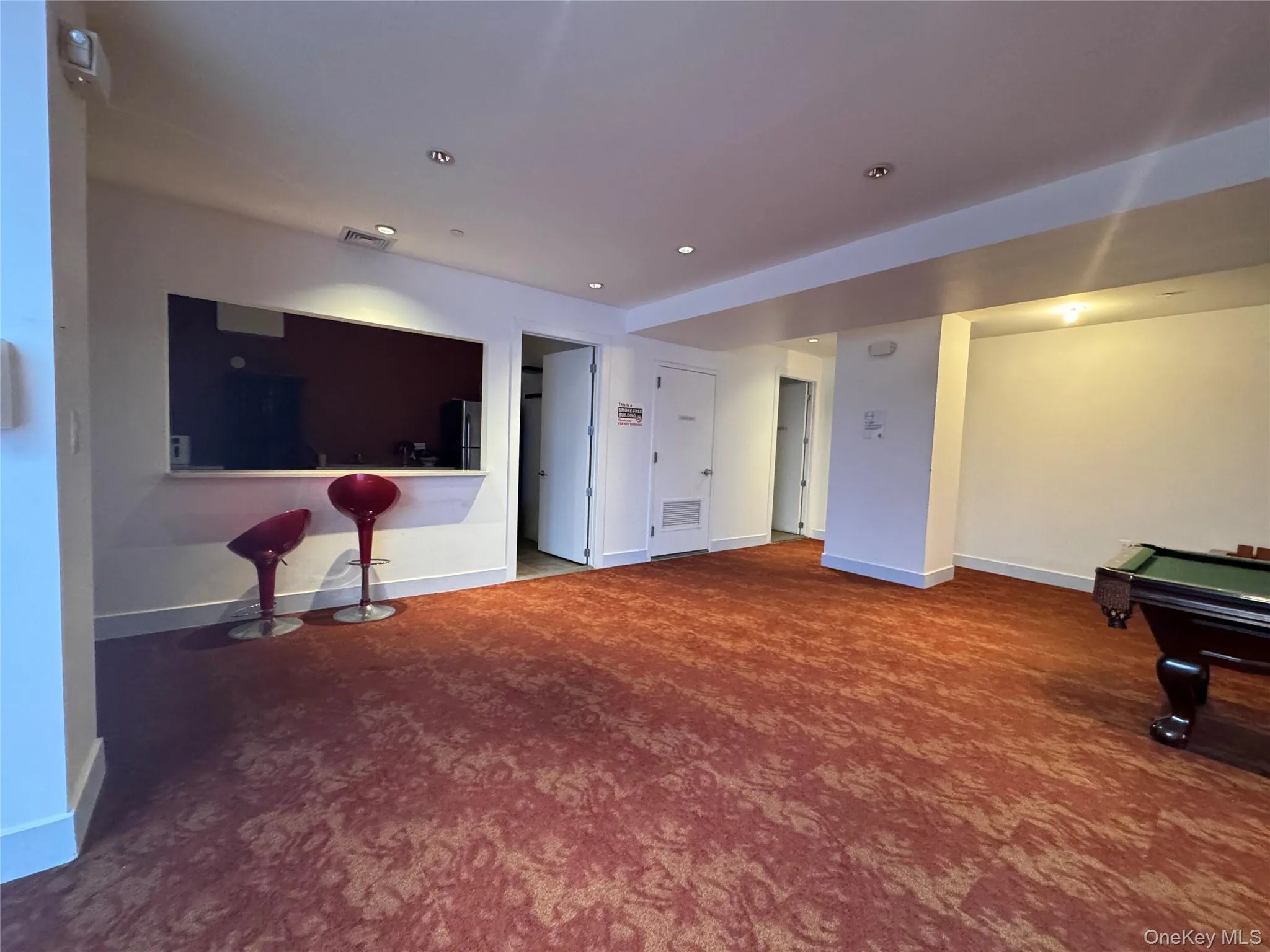 Living area featuring dark carpet, pool table, and recessed lighting Living area featuring dark carpet, pool table, and recessed lighting