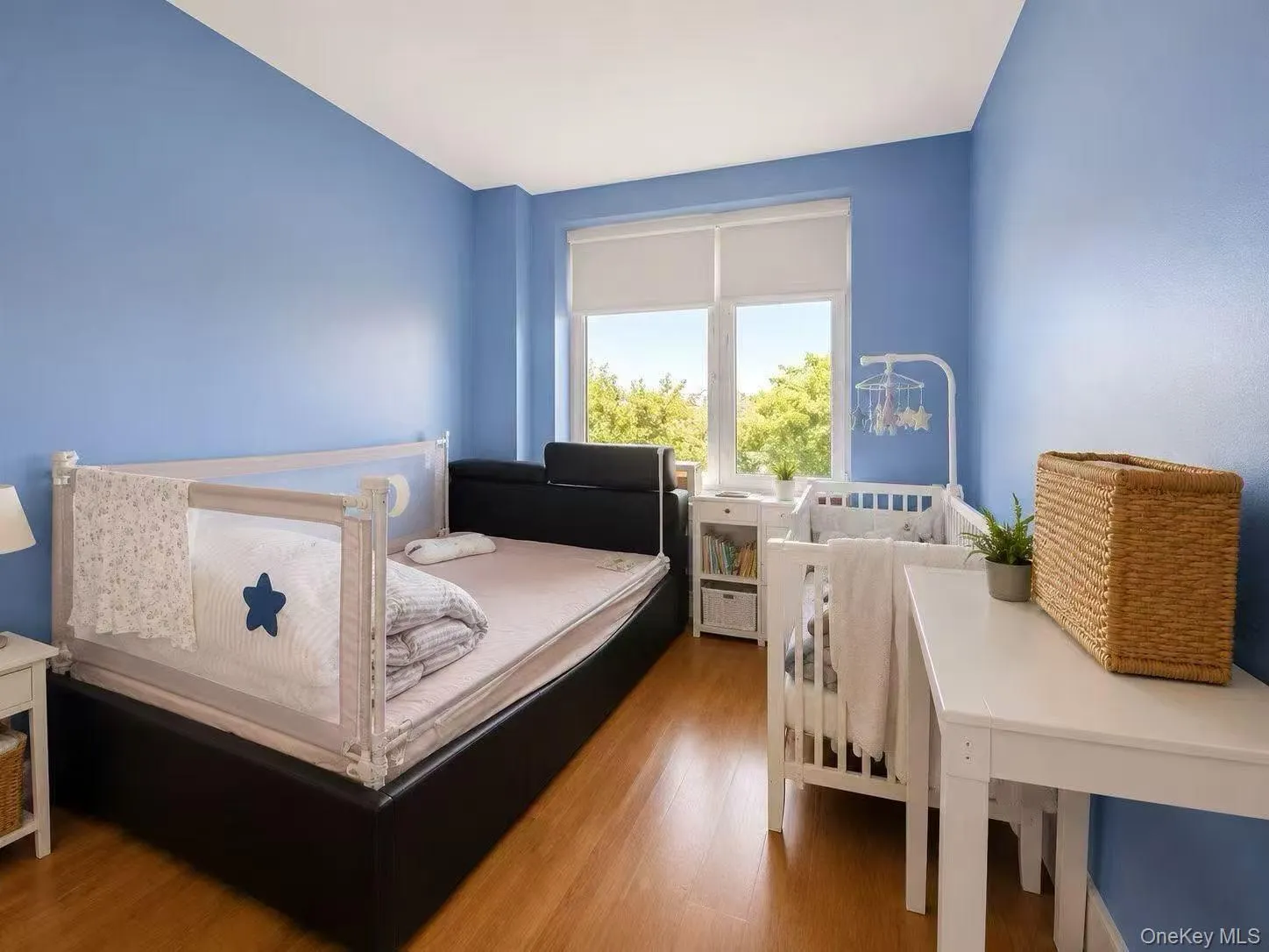 Bedroom with wood finished floors Bedroom with wood finished floors