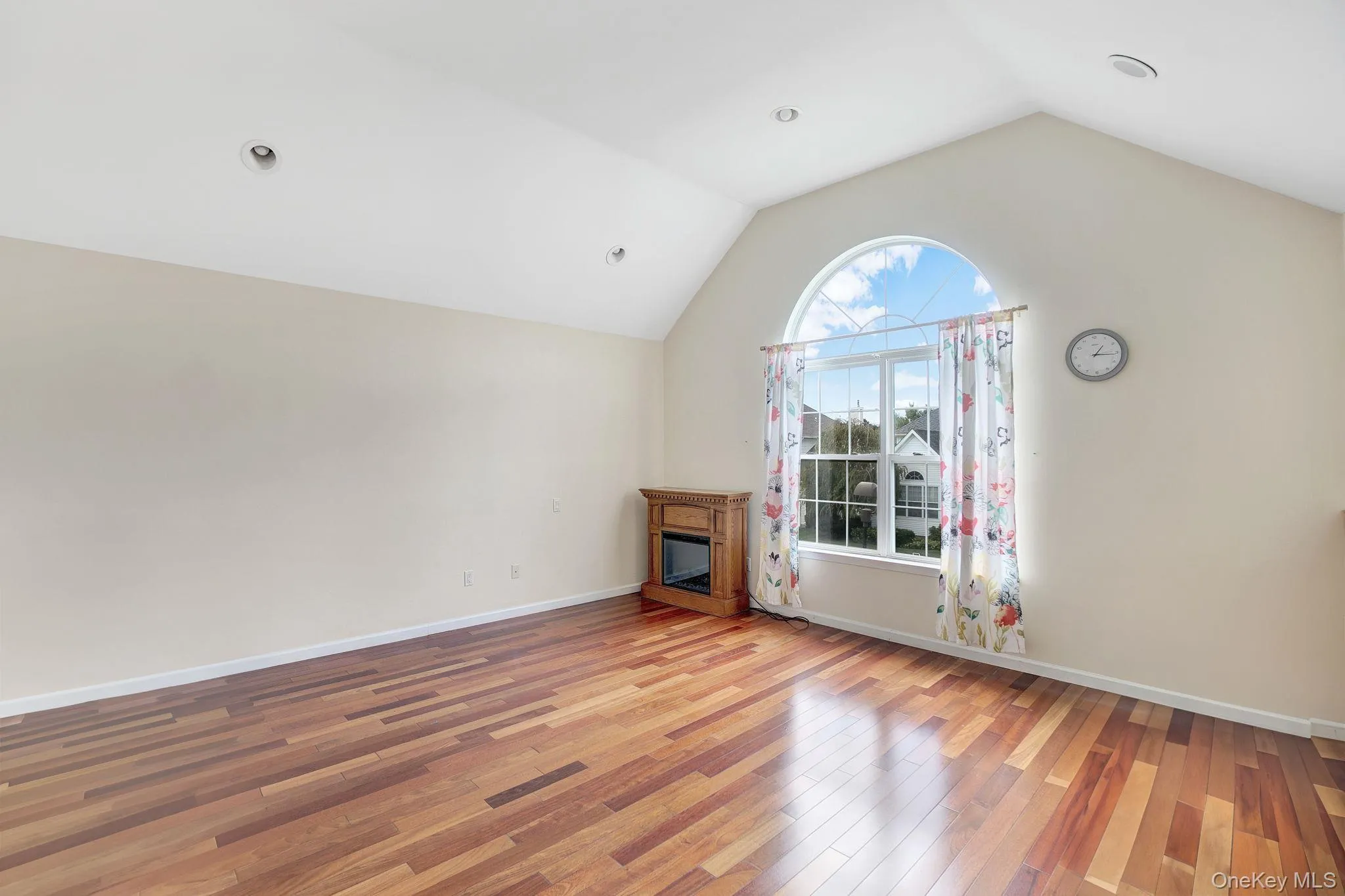 Bonus room with vaulted ceiling and light wood-type flooring Bonus room with vaulted ceiling and light wood-type flooring