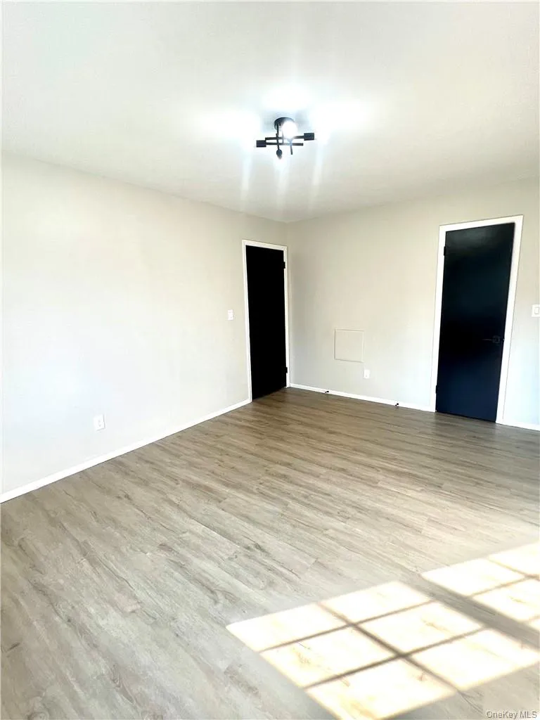 Spare room with ceiling fan and light hardwood / wood-style floors Spare room with ceiling fan and light hardwood / wood-style floors