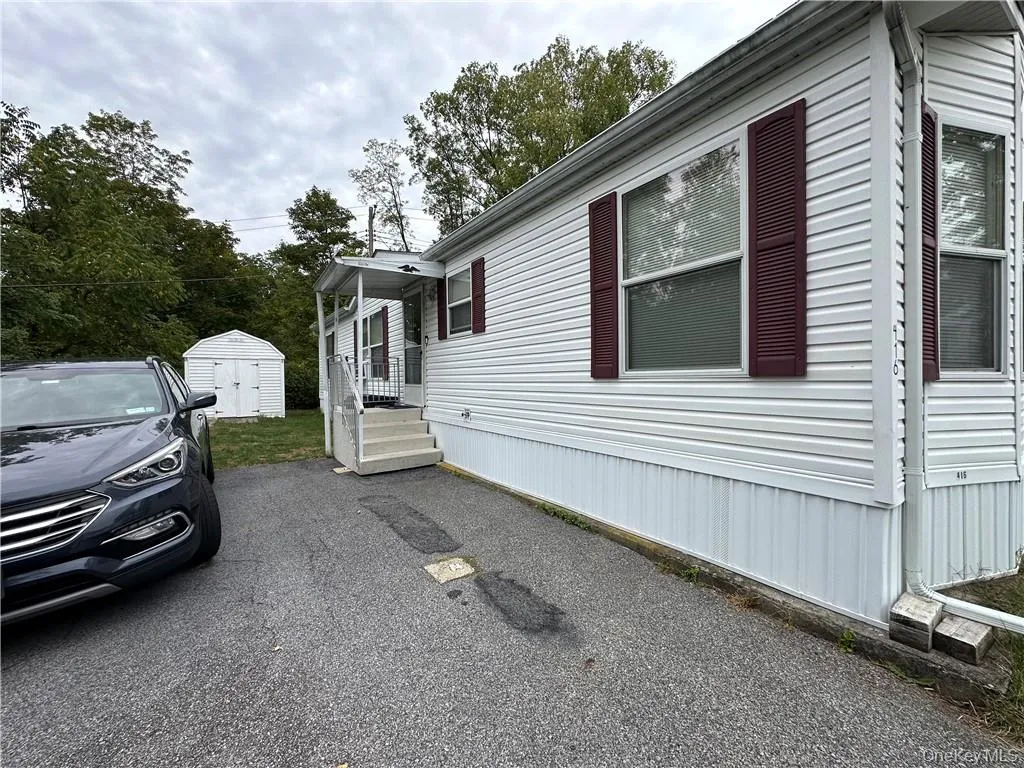 View of side of home with a shed View of side of home with a shed