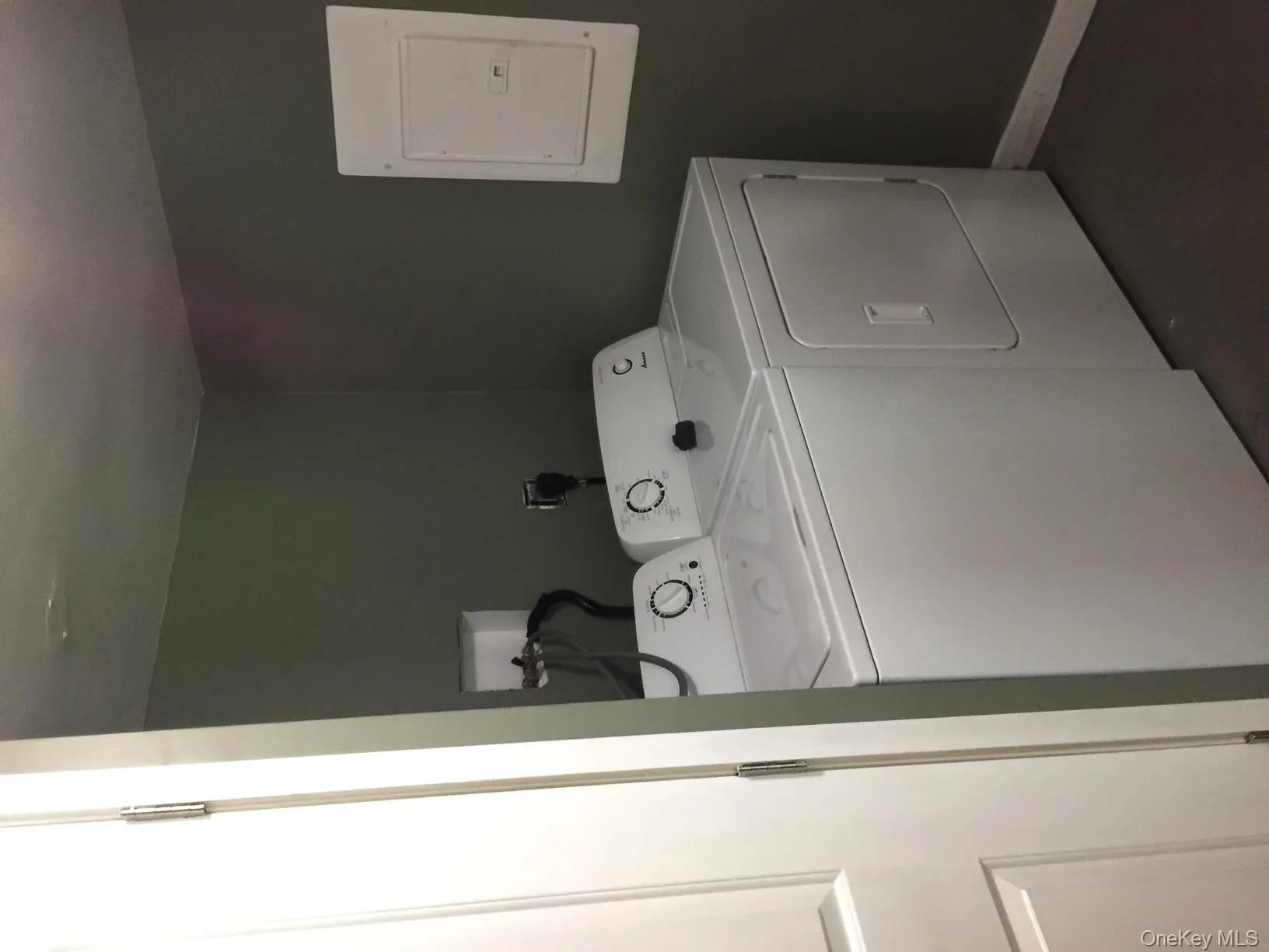 Laundry room with electric panel and washer and clothes dryer Laundry room with electric panel and washer and clothes dryer