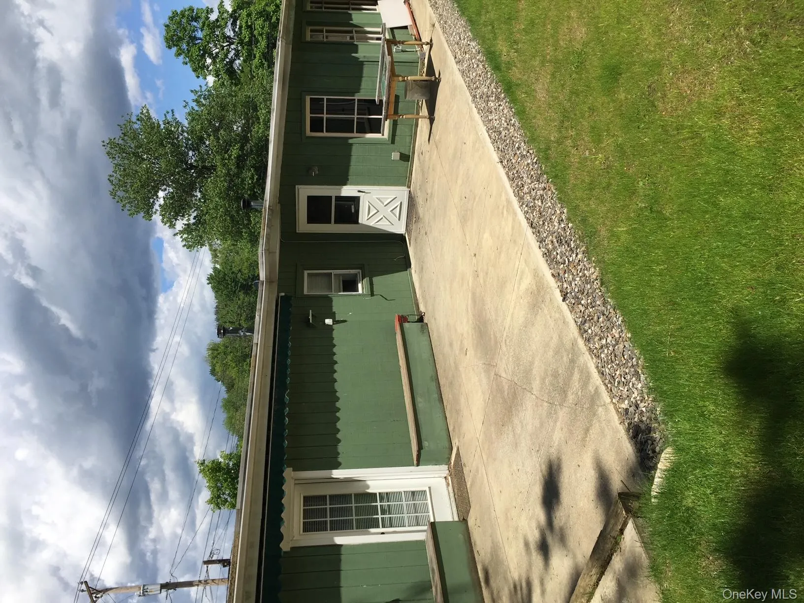 Rear view of property with a lawn Rear view of property with a lawn