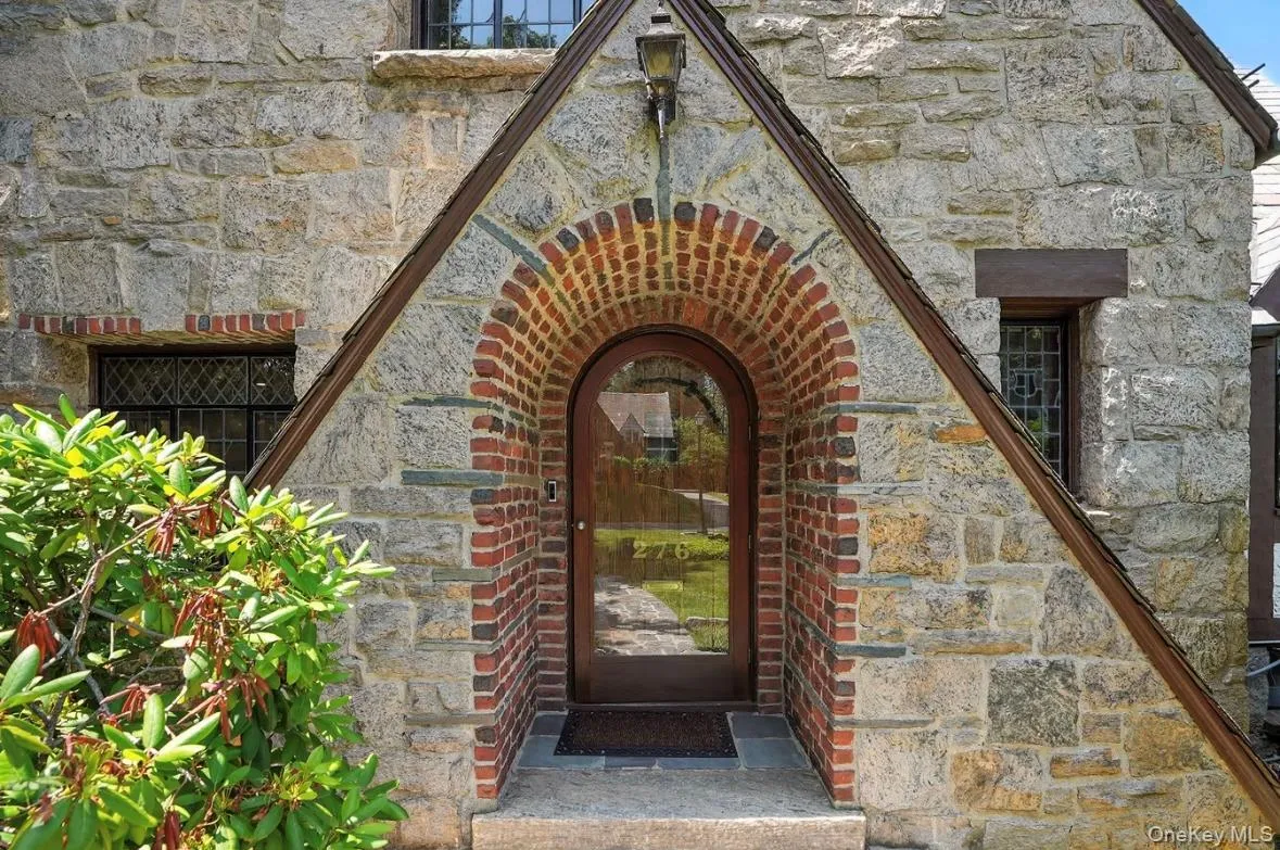 View of exterior entry featuring stone siding View of exterior entry featuring stone siding