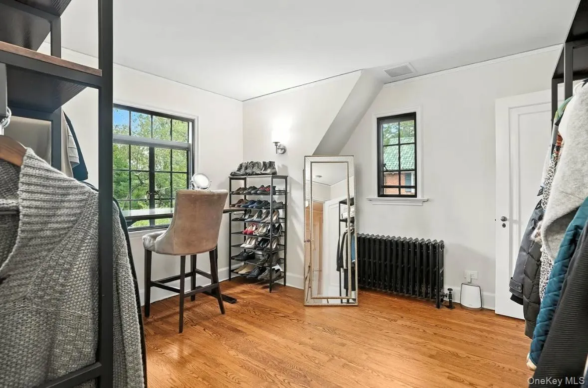 Office area featuring light wood-style flooring and radiator Office area featuring light wood-style flooring and radiator