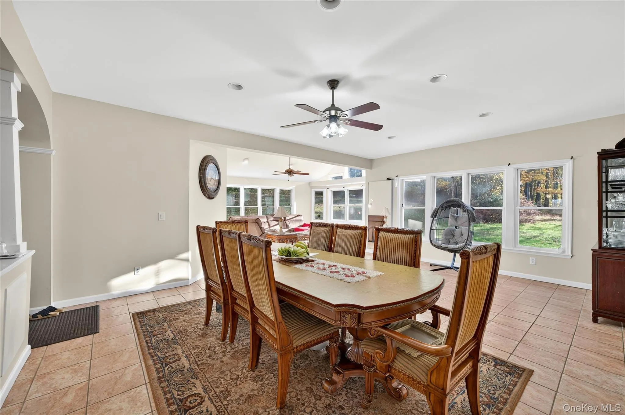 Dining room featuring light tile patterned floors and ceiling fan Dining room featuring light tile patterned floors and ceiling fan