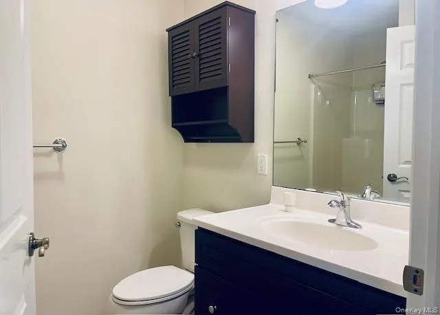 Bathroom with a shower and vanity Bathroom with a shower and vanity