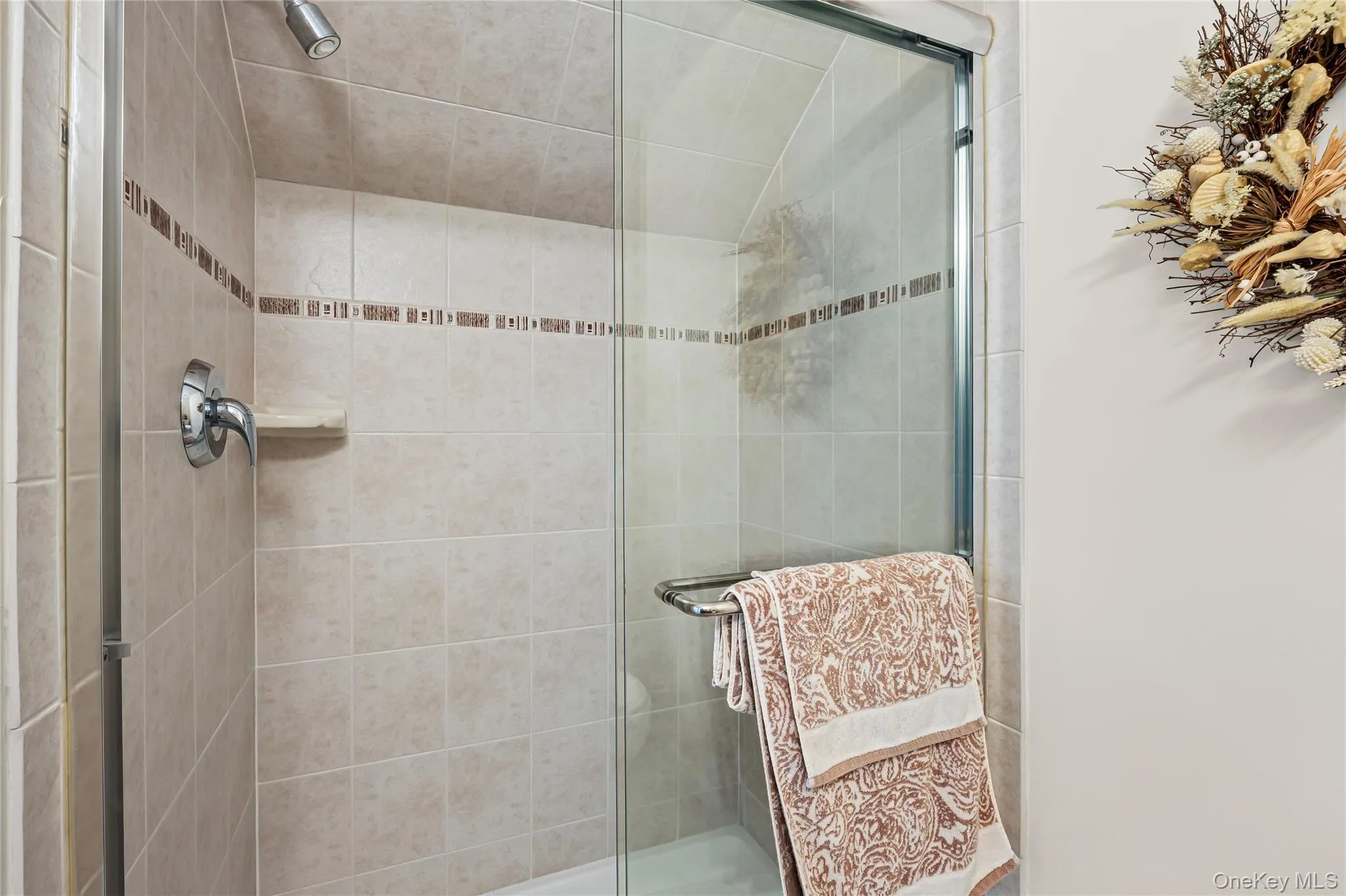 Bathroom featuring a shower stall Bathroom featuring a shower stall