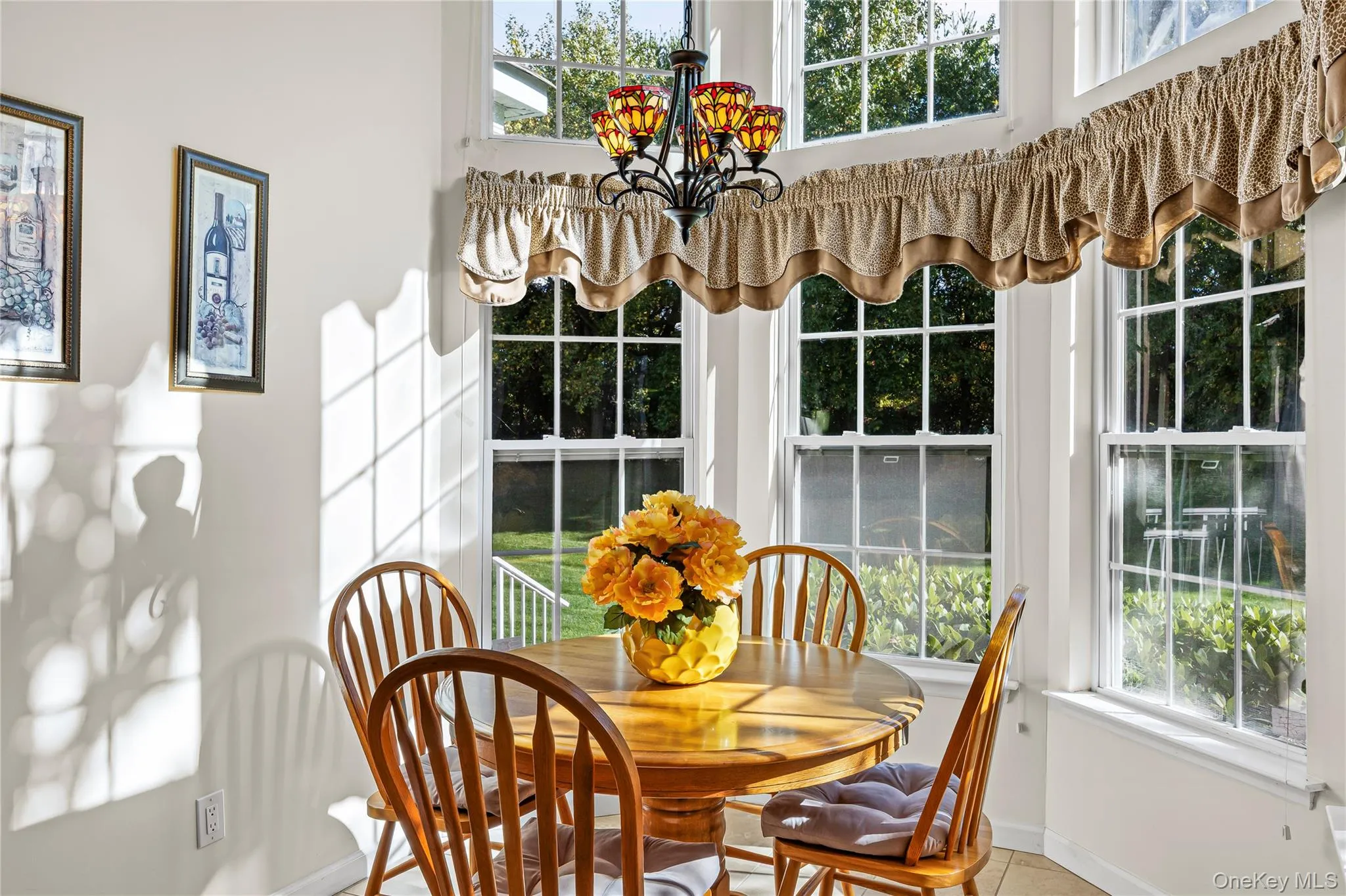 Sunroom featuring a chandelier Sunroom featuring a chandelier